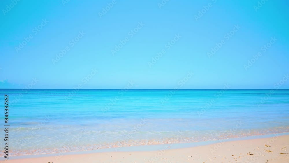 Calm tropical sea on the beach against the morning sky. Background of summer wave of the Atlantic ocean on a sandy beach. Summer tropical nature landscape. Cruise. Warm water for outdoor bathing. Calm tropical sea on the beach against the morning sky. Background of summer wave of the Atlantic ocean on a sandy beach. Summer tropical nature landscape. Cruise. Warm water for outdoor bathing.