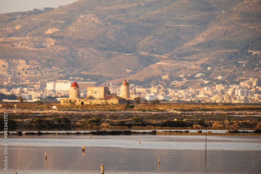 Obraz premium Trapani salt pond view at sunset in Mediterranean Sea