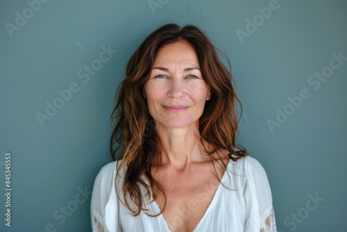 A close up portrait of a woman with a subtle smile © MagnusCort