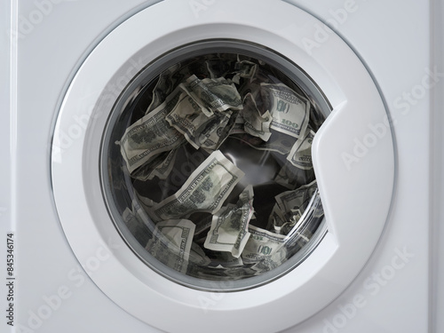 Hundred dollar bills inside the rotating drum of a washing machine. Dirty american paper money in the washing machine.