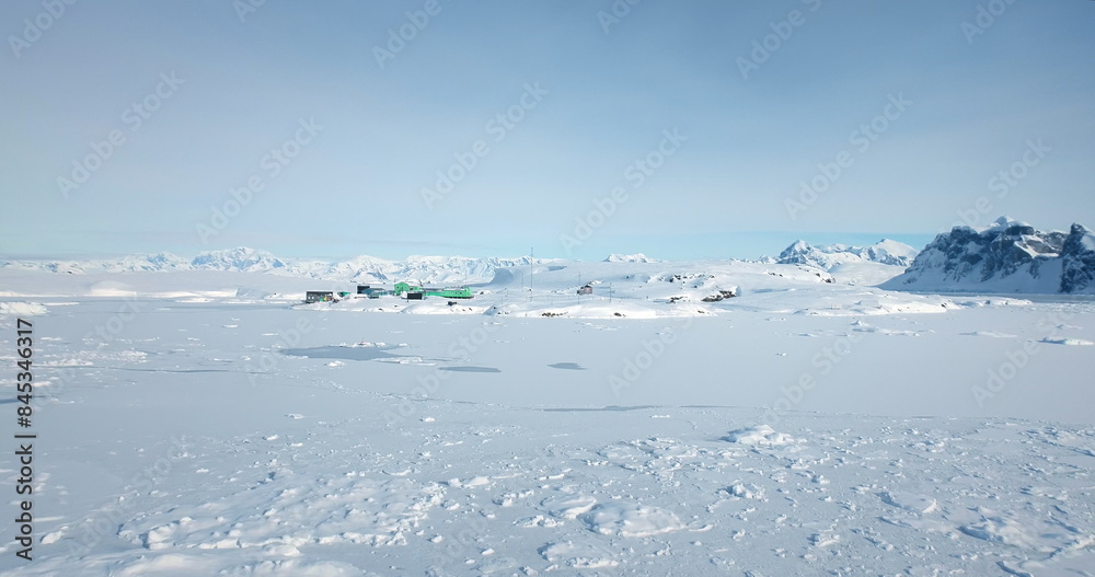 Antarctic polar station scientific research base in remote extreme Antarctica region covered with snow and ice measuring global warming weather changes. Aerial winter landscape, travel and exploration Antarctic polar station scientific research base in remote extreme Antarctica region covered with snow and ice measuring global warming weather changes. Aerial winter landscape, travel and exploration