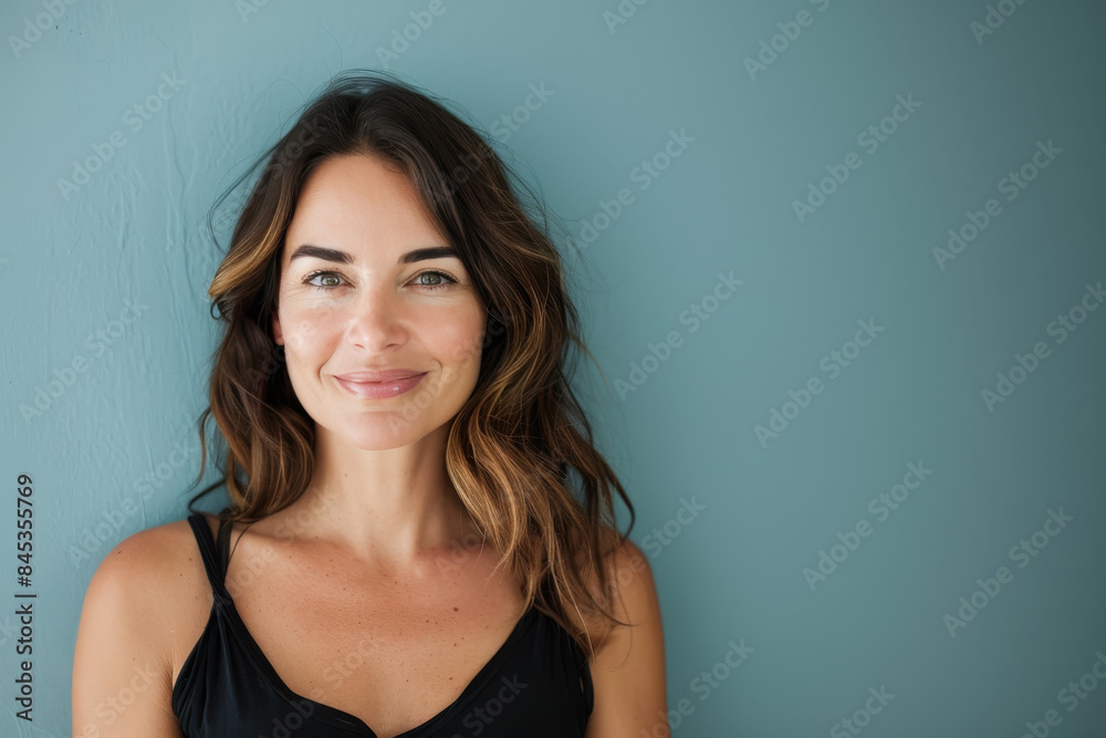 A close up portrait of a woman with a subtle smile A close up portrait of a woman with a subtle smile