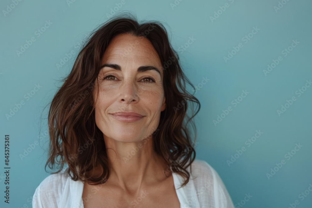 A close up portrait of a woman with a subtle smile