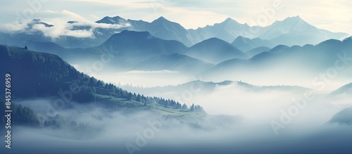 Beautiful green mountain with the fog in the morning. Creative banner. Copyspace image © HN Works