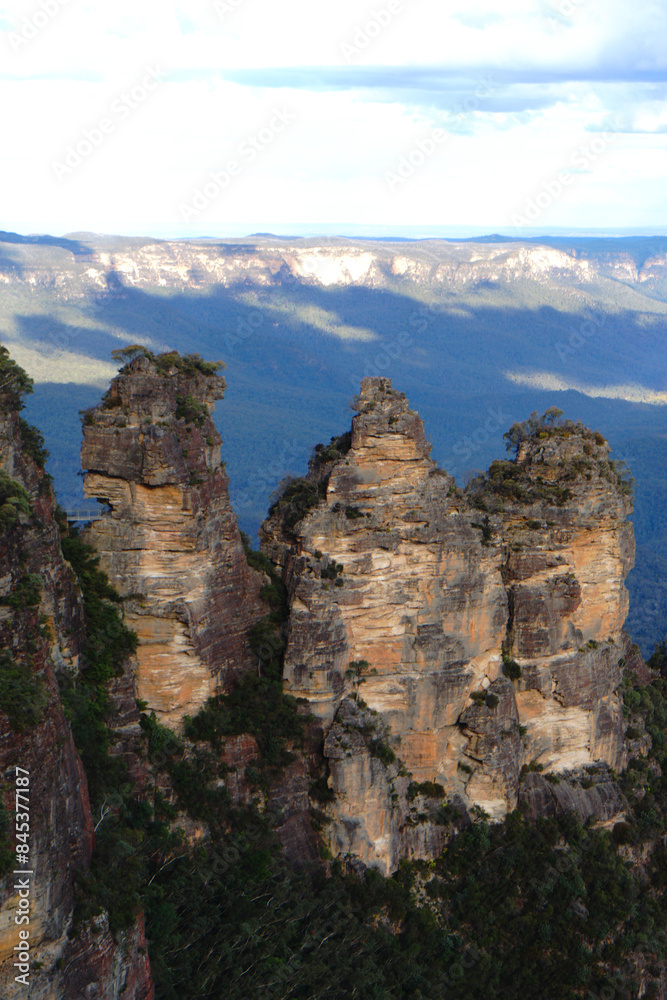 Naklejka premium Landscape of The Three Sisters are an unusual rock formation in the Blue Mountains National Park of Katoomba , New South Wales, Australia, on the north escarpment of the Jamison Valley - Nature Track