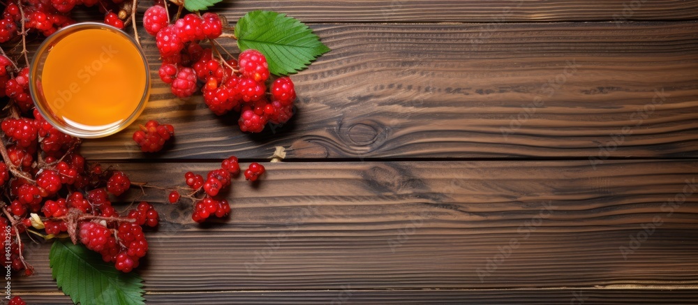 Fruit tea with berries viburnum on a wooden surface top view. Creative banner. Copyspace image Fruit tea with berries viburnum on a wooden surface top view. Creative banner. Copyspace image