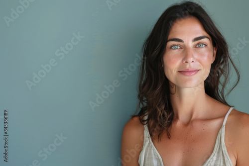 A close up portrait of a woman with a subtle smile