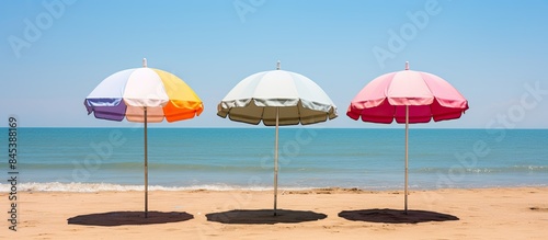 recreation concept beach umbrella lying on sandy beach. Creative banner. Copyspace image