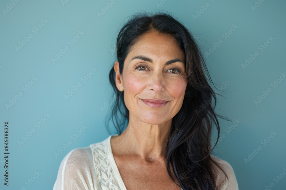 A close up portrait of a woman with a subtle smile A close up portrait of a woman with a subtle smile