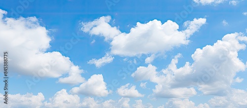 Blue sky with slight white clouds sunny day sky background. Creative banner. Copyspace image