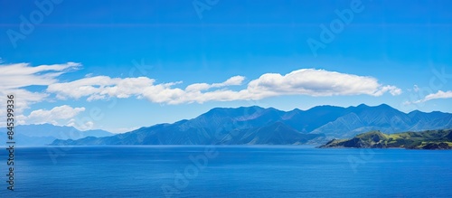 Panoramic views of the blue sky and mountains above the ocean. Creative banner. Copyspace image