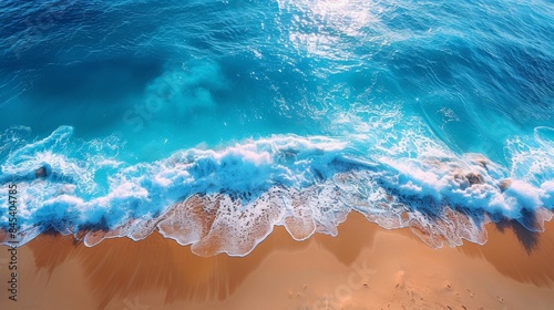 This image captures the serene beauty of a crystal clear ocean wave gently approaching a sandy beach, evoking feelings of tranquility and relaxation