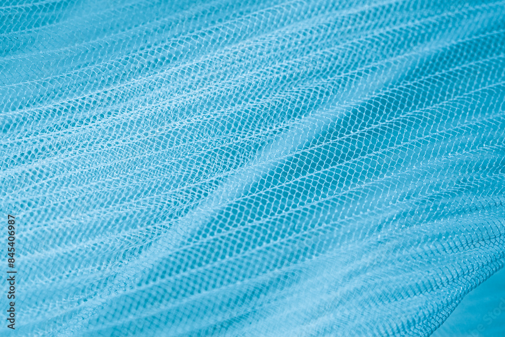 closeup of blue corrugated organza textured background closeup of blue corrugated organza textured background