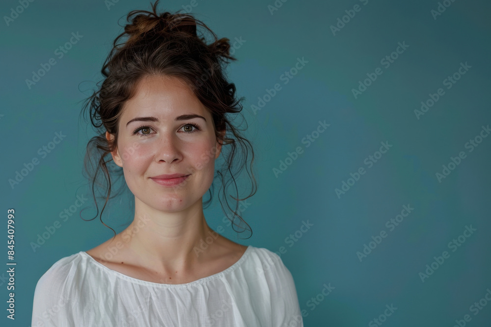 A close up portrait of a woman with a subtle smile A close up portrait of a woman with a subtle smile