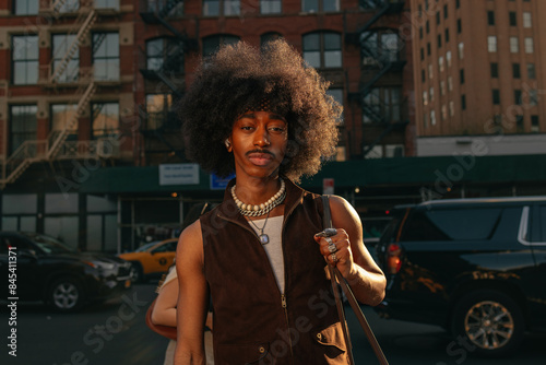 Photography Stylish man walking in the city at sunset