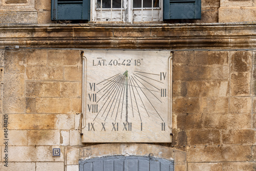 Obraz na płótnie Sundial on facade of Civic Tower (Torre dell'Orologio) and University Palace, located in Plebiscito Square, Martina Franca, Italy, Puglia w salonie