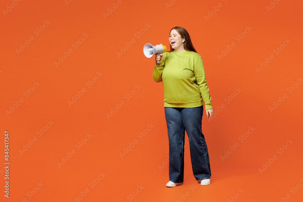 Full body young ginger fat chubby plus size woman wear green sweatshirt casual clothes hold megaphone scream announces discounts sale Hurry up isolated on red orange background. Body positive concept. Full body young ginger fat chubby plus size woman wear green sweatshirt casual clothes hold megaphone scream announces discounts sale Hurry up isolated on red orange background. Body positive concept.