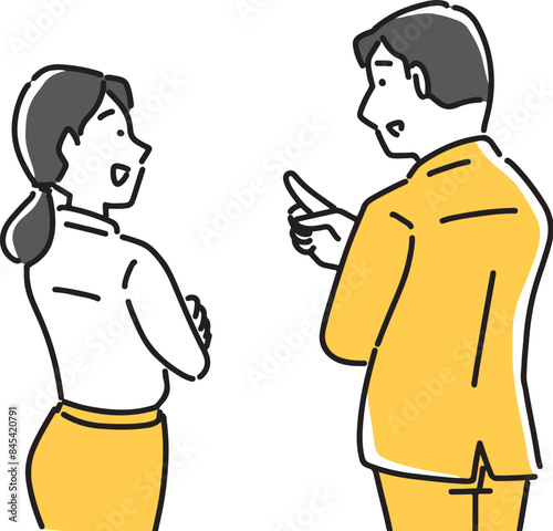 後ろ姿で話をする男女社員