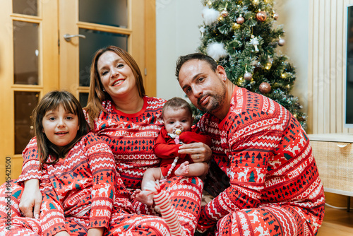 Cozy family Christmas moment with matching outfits photo