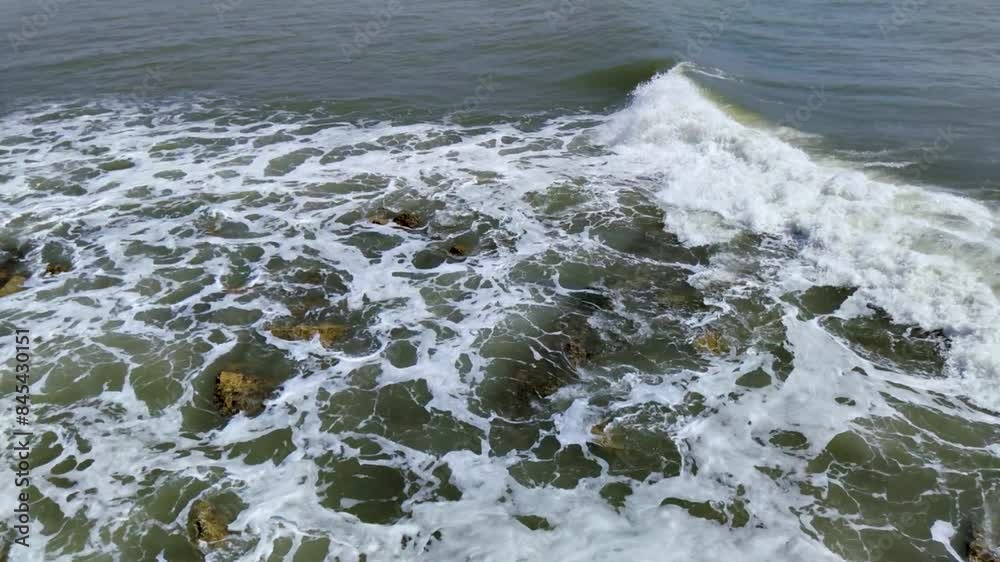 Waves crashing on rocks in slowmotion at beach, Full HD Waves crashing on rocks in slowmotion at beach, Full HD