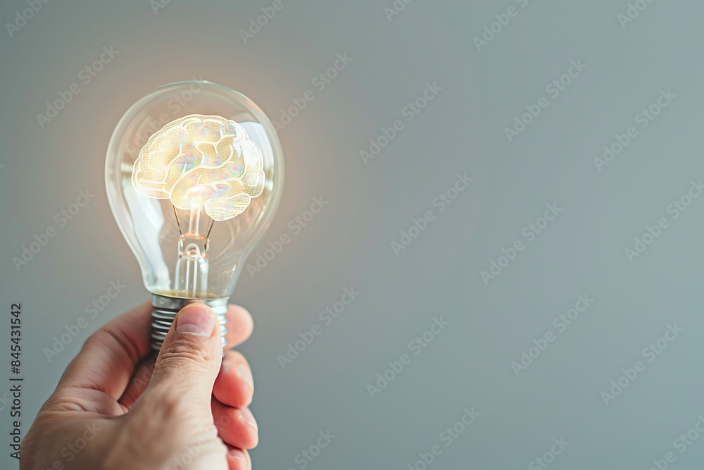 Man holding a lightbulb Creative new idea. Brainstorming or excellent idea generation. Man holding a lightbulb Creative new idea. Brainstorming or excellent idea generation.