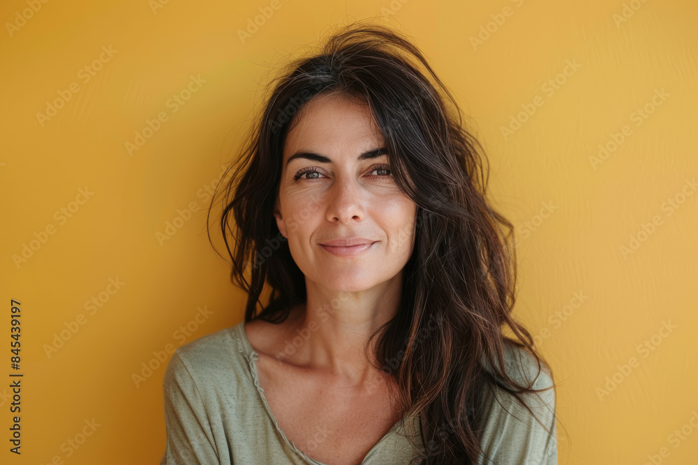 A close up portrait of a woman with a subtle smile A close up portrait of a woman with a subtle smile