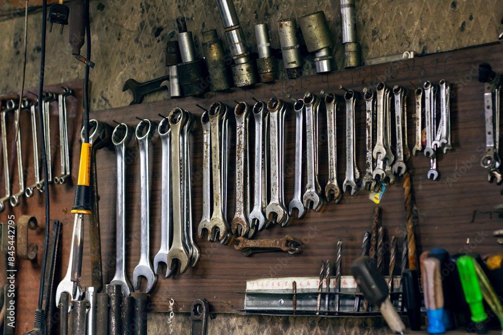 Various tools on the wall hand tools, ratchets, wrenches, cutting tools Various tools on the wall hand tools, ratchets, wrenches, cutting tools