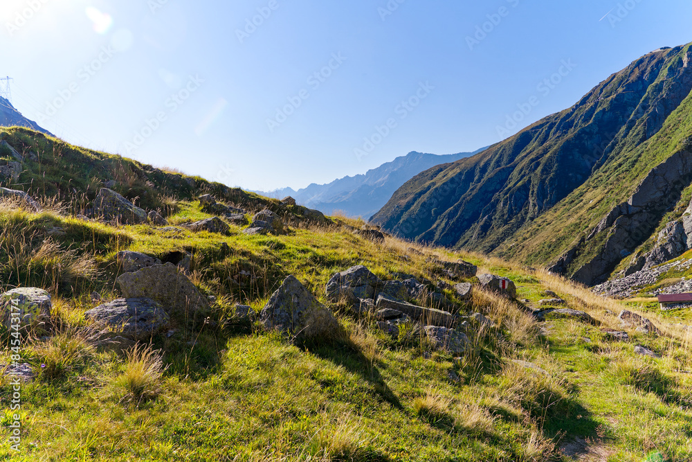 Naklejka premium Scenic view at Swiss mountain pass Gotthard with alpine landscape on a sunny late summer day. Photo taken September 10th, 2023, Gotthard, Canton Ticino, Switzerland.