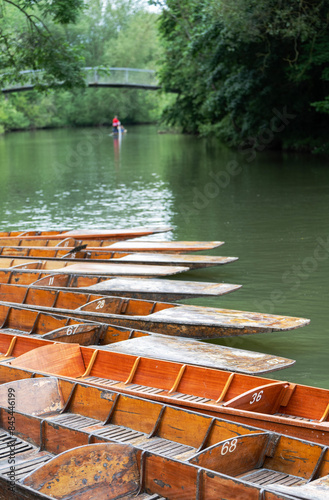 Toursits Punting In Wooden Punts On River Cherwell In Oxford UK photo