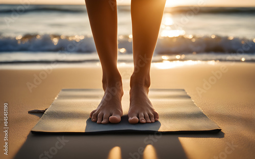 Low angle view of a yogi’s feet on a mat during sunrise yoga, tranquil beach setting, serene vibes