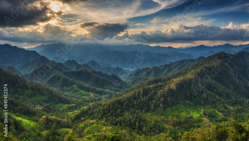 Breathtaking mountain forest vista with cloudy sky. Green scenery of Maehongson, Thailand.