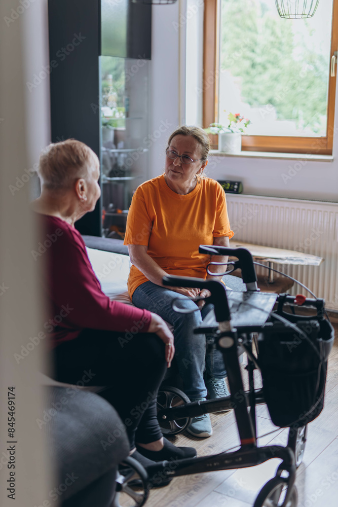 A social worker talks to a lonely old woman.Loneliness of elderly people A social worker talks to a lonely old woman.Loneliness of elderly people
