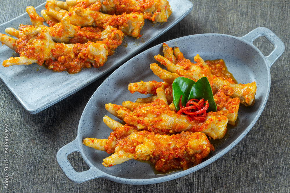 Fototapeta premium ceker mercon, indonesia food made from chicken feet cooked with spicy seasonings. top view food