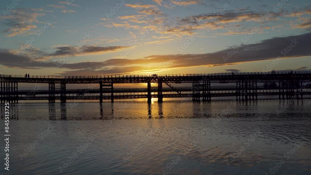 Sunset behind historical pier of Huelva Spain Sunset behind historical pier of Huelva Spain