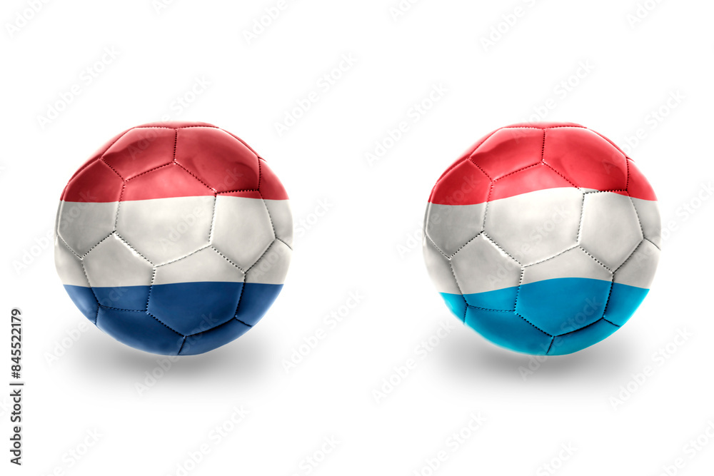 football balls with national flags of luxembourg and netherlands ,soccer teams. on the white background. football balls with national flags of luxembourg and netherlands ,soccer teams. on the white background.