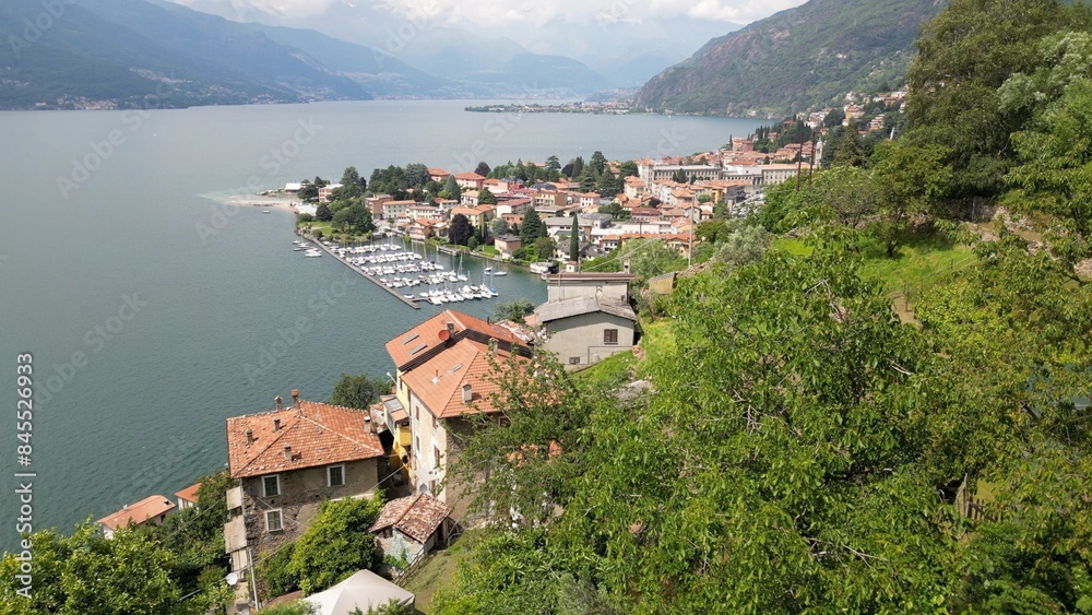 Bellano and Varena are a csmall town on the eastern shore of Lake Como in the Province of Lecco in the Italian region Lombardy. Drone aerial view from Cammino del Viandante walking for tourist
