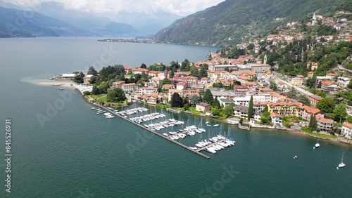 Obraz na płótnie Bellano and Varena are a csmall town on the eastern shore of Lake Como in the Province of Lecco in the Italian region Lombardy. Drone aerial view from Cammino del Viandante walking for tourist w salonie