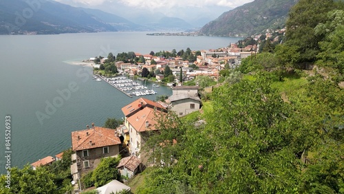 Obraz na płótnie Bellano and Varena are a csmall town on the eastern shore of Lake Como in the Province of Lecco in the Italian region Lombardy. Drone aerial view from Cammino del Viandante walking for tourist w salonie