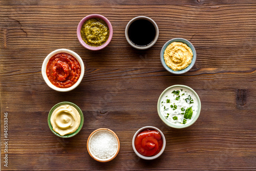 Bowls with various sauces for the meat or vegetables. Food background