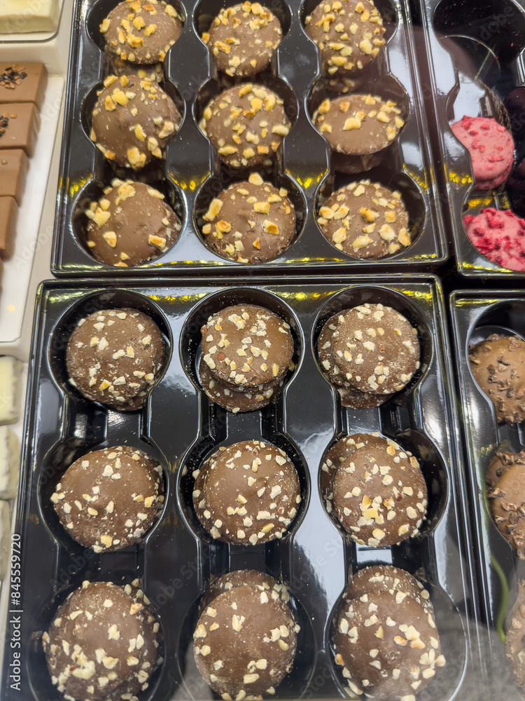 chocolate and candies in a box on a store shelf chocolate and candies in a box on a store shelf