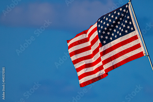 American Flag Blowing in the Wind at Sunset