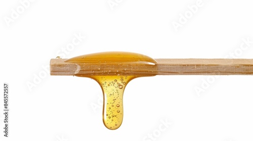 Close-up of Honey Dripping from Wooden Stick, Generative AI photo