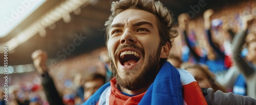 Excited Fan Cheers During A Night Game At A Stadium