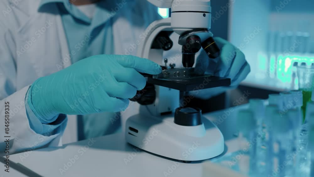 professional scientist is analyzing some liquid sample to test a new vaccine for terminate virus, in a laboratory has so many science equipment which is microscope, test tube and dropper professional scientist is analyzing some liquid sample to test a new vaccine for terminate virus, in a laboratory has so many science equipment which is microscope, test tube and dropper