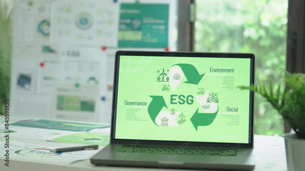 ESG ( environment, social,governance) recycle sign on laptop screen with carbon free chart board in office ESG ( environment, social,governance) recycle sign on laptop screen with carbon free chart board in office