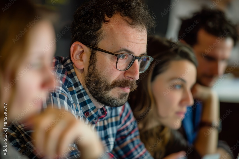 Fototapeta premium Collaborative Problem-Solving Session with Team Leader and Engaged Participants