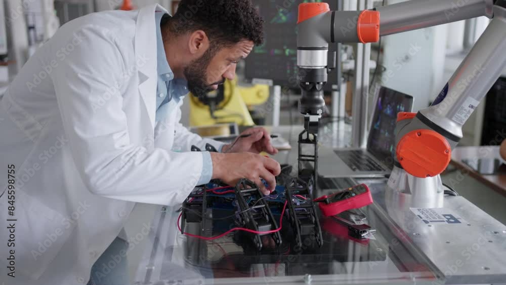 Robotics Systems Engineer Robotic engineer working on mechanical system of robotic arm ...