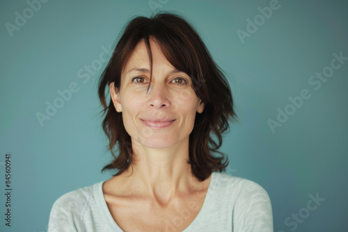 A close up portrait of a woman with a subtle smile © MagnusCort