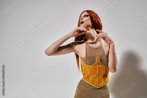 Canvas Print A drag diva strikes a pose in a shimmering gold outfit.