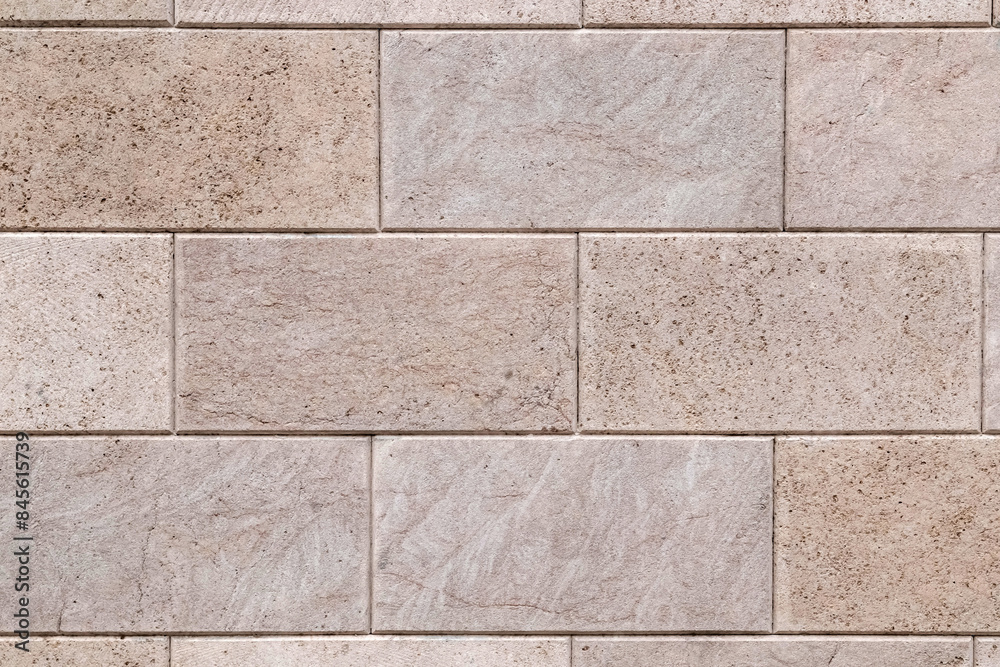 Obraz premium Shell stone tile wall as background. Old natural block wall with rough surface